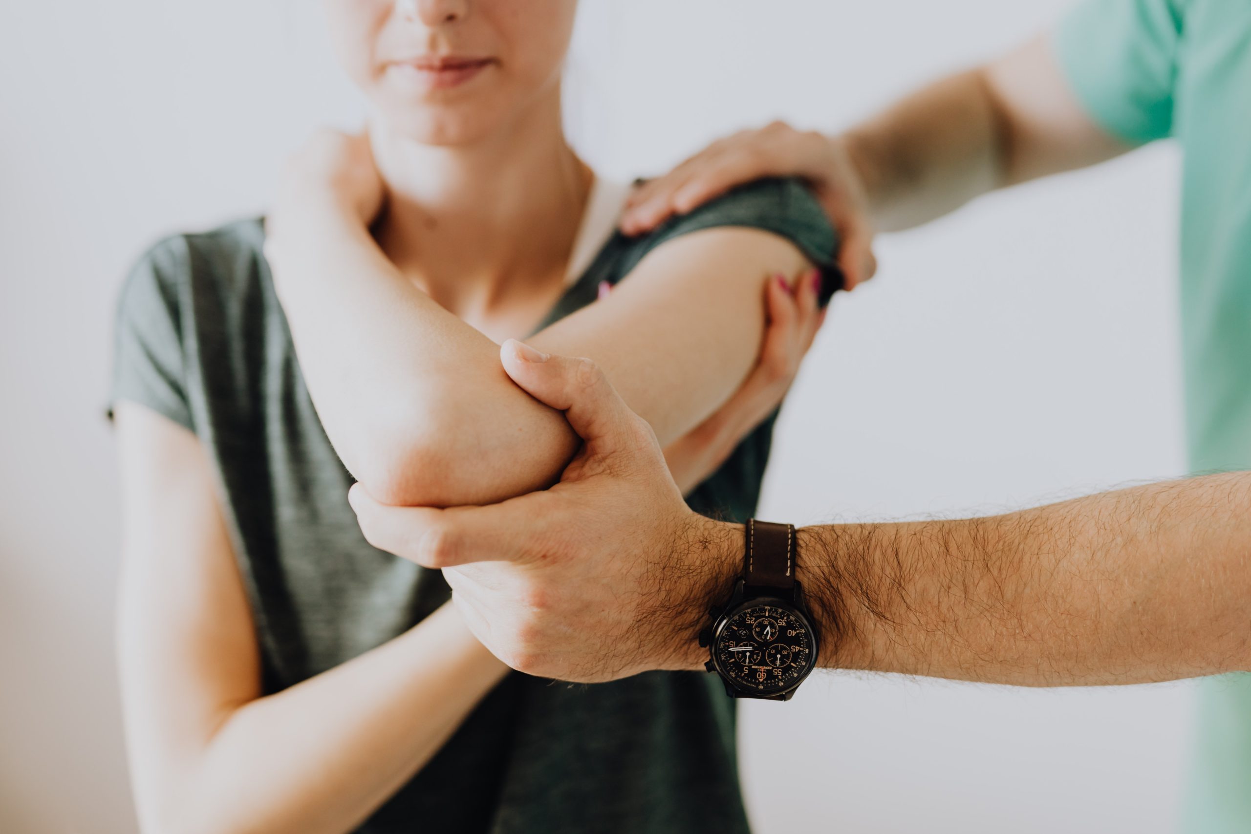Osteopath treating elbow